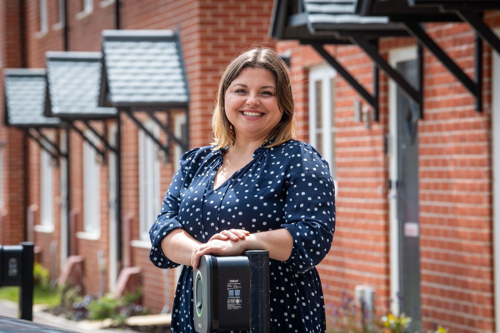 Anna stood outside some homes