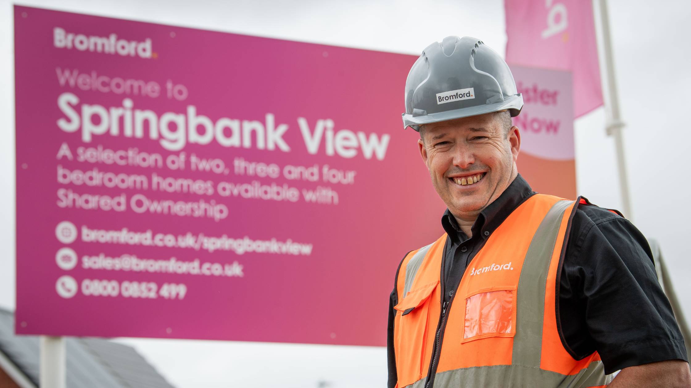 James in front of a sign saying 'Springbank View'