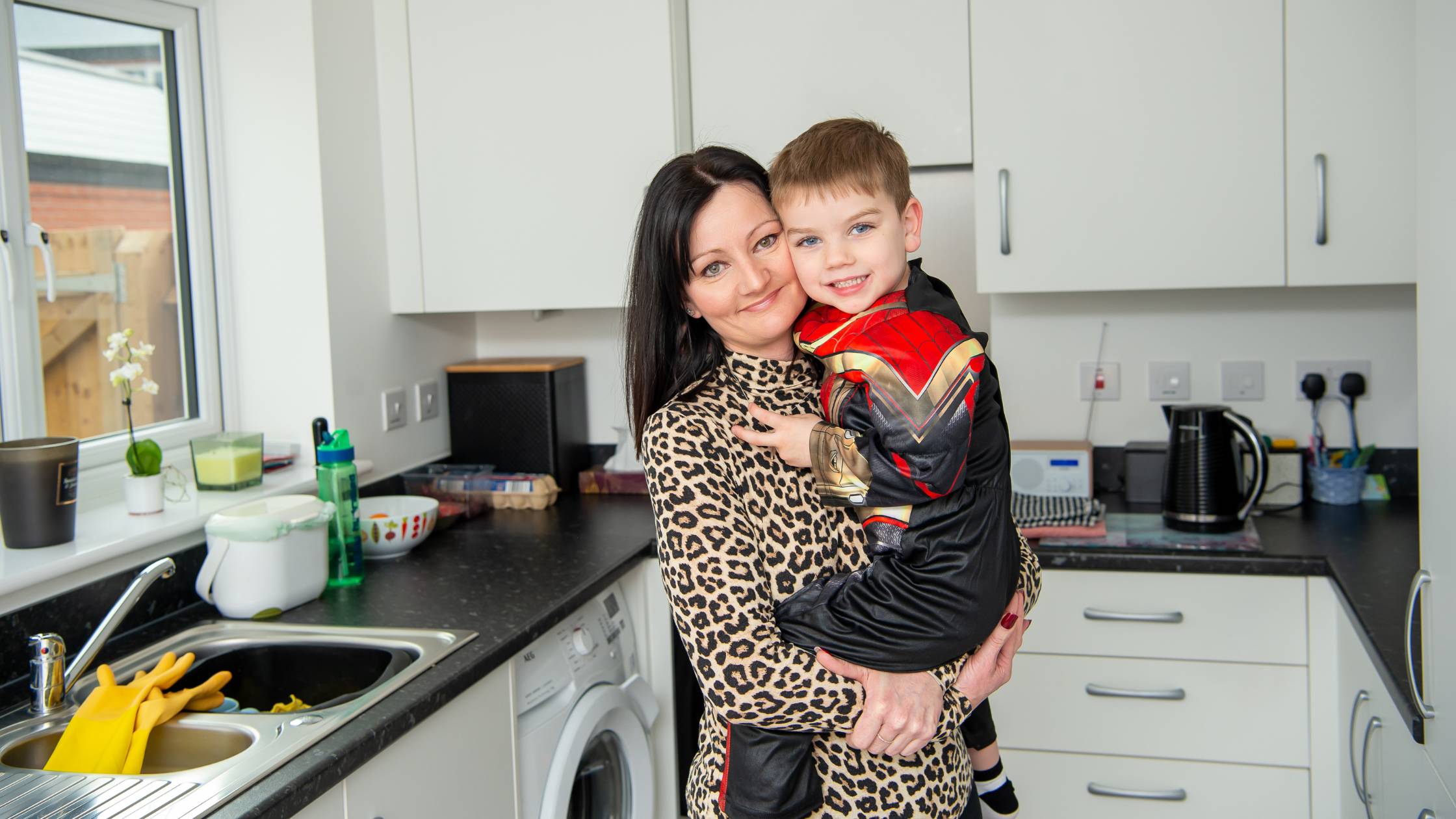 Bromford customer and her son in their kitchen