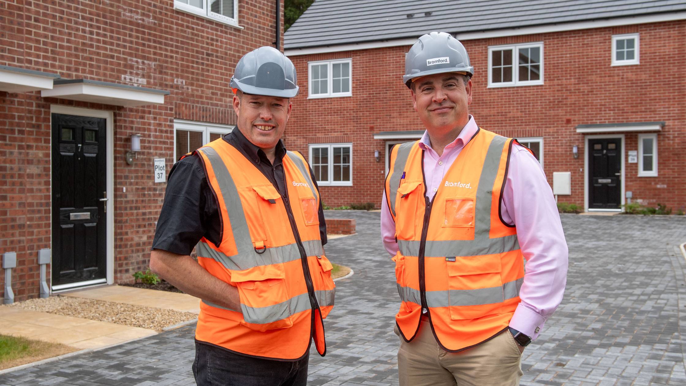 James and Simon in hard hats and hi-vis jackets
