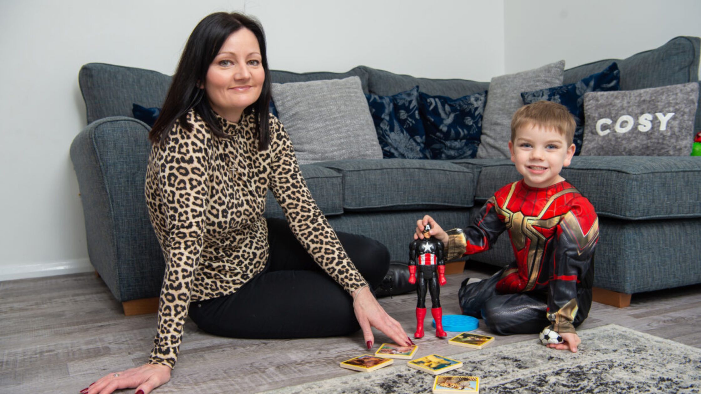 Bromford customer and her son playing on the floor of their new home