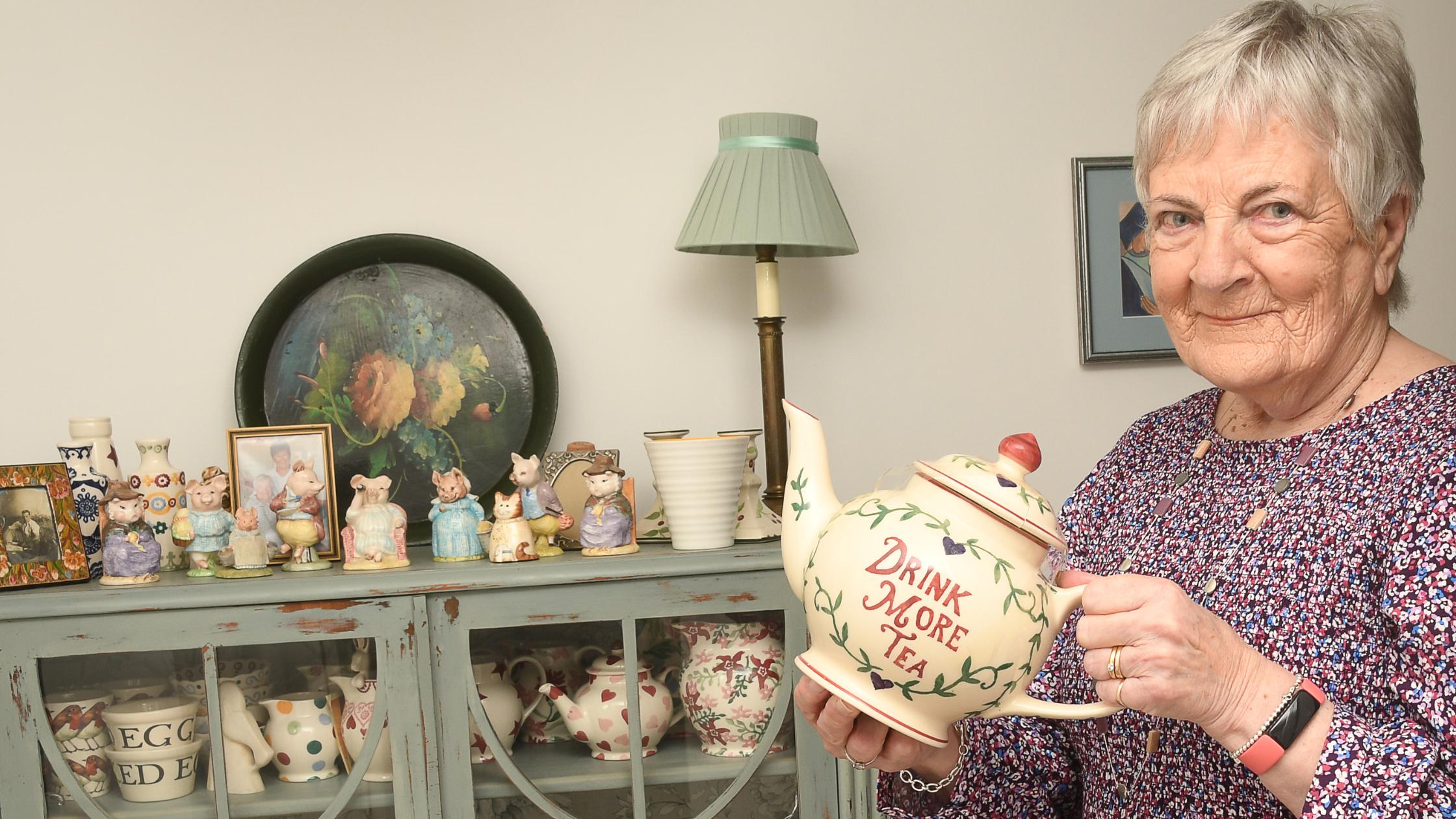 Mary holding a teapot